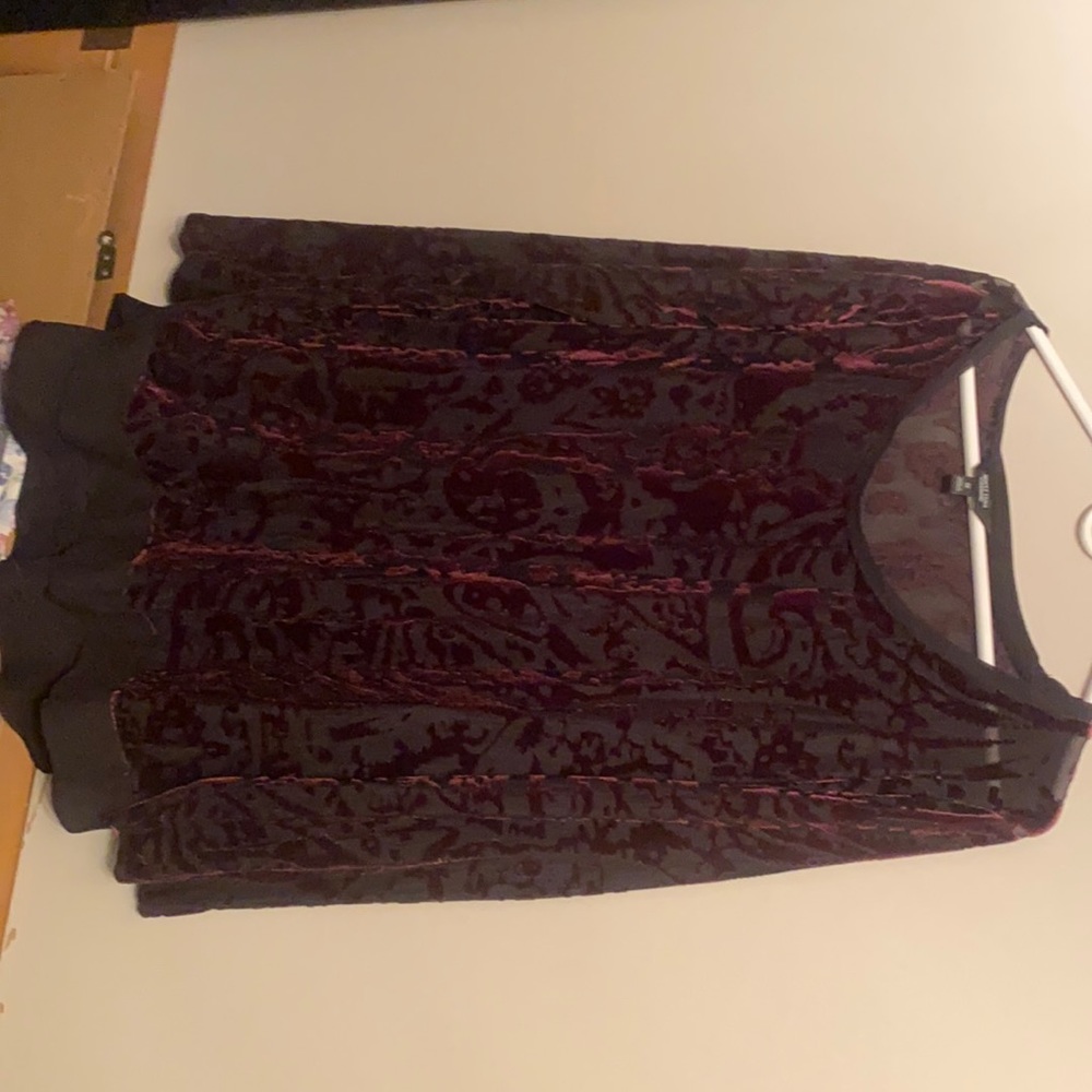 Woman’s Plum colored long sleeve blouse